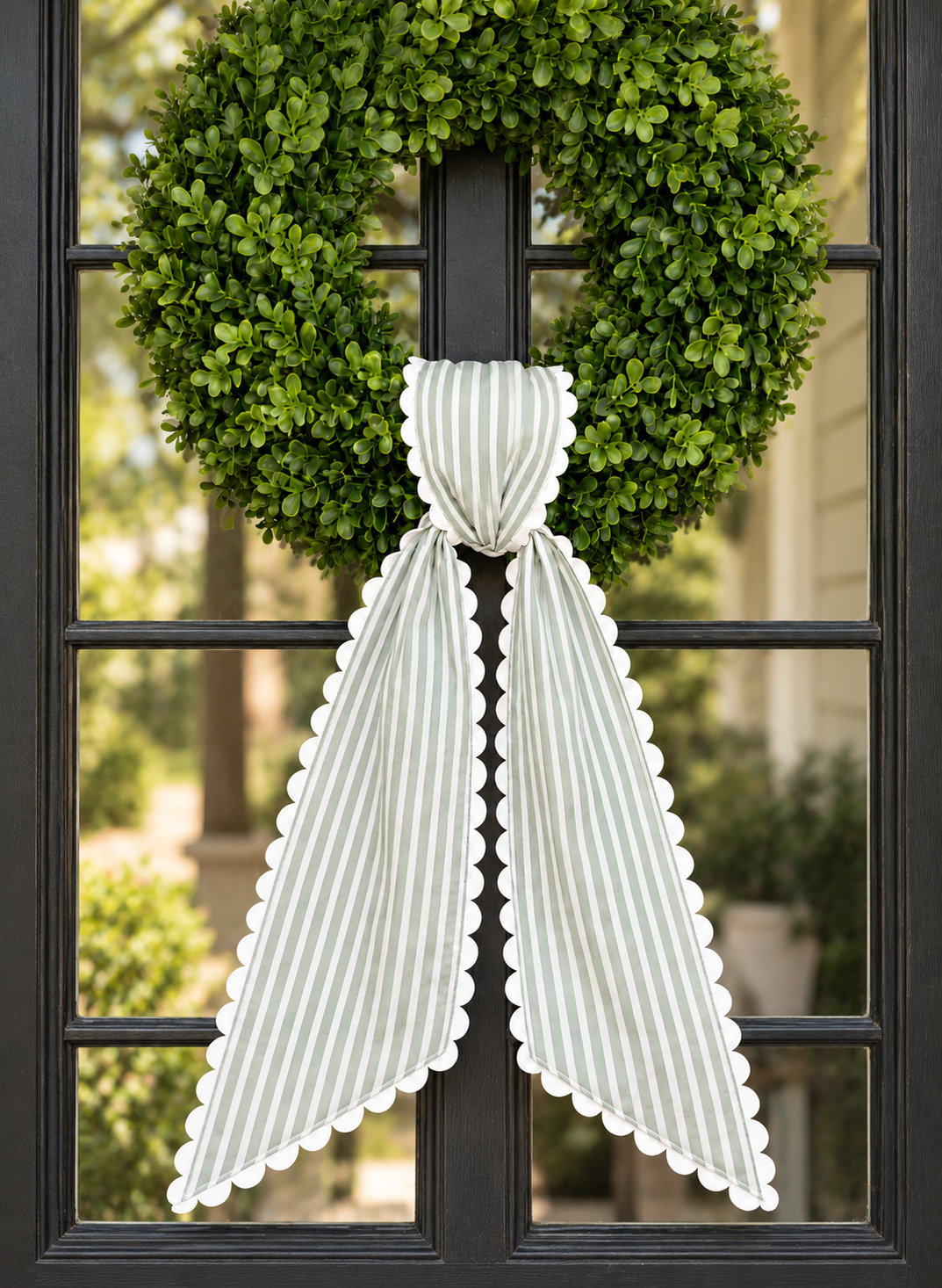 Sage stripe wreath sash with white scalloped ric rac trim, embroidery blank on a boxwood wreath