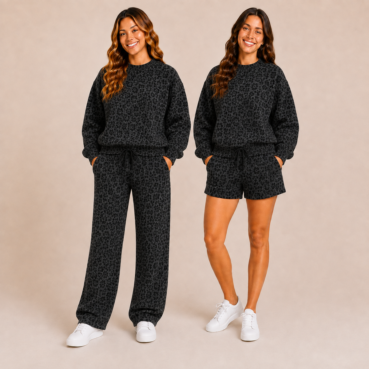 Two women modeling matching black leopard-print loungewear sets against a solid beige studio background. One model wears a sweatshirt and wide-leg pants, and the other wears a matching sweatshirt and shorts.