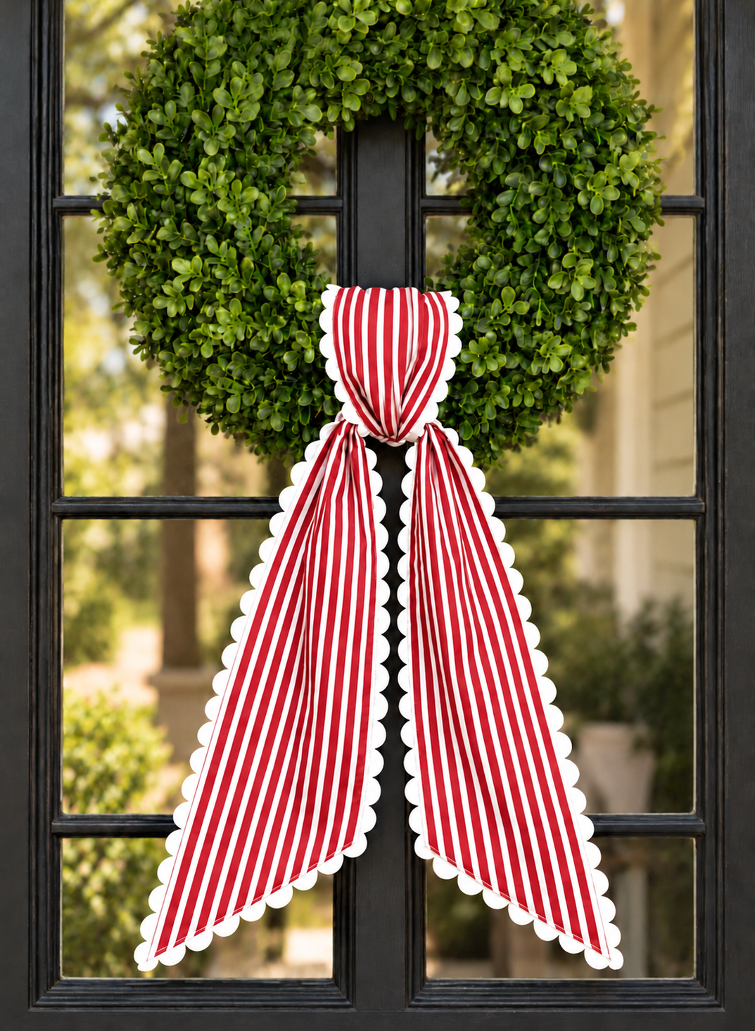 Red stripe wreath sash with white scalloped ric rac trim, Christmas embroidery blank on a boxwood wreath