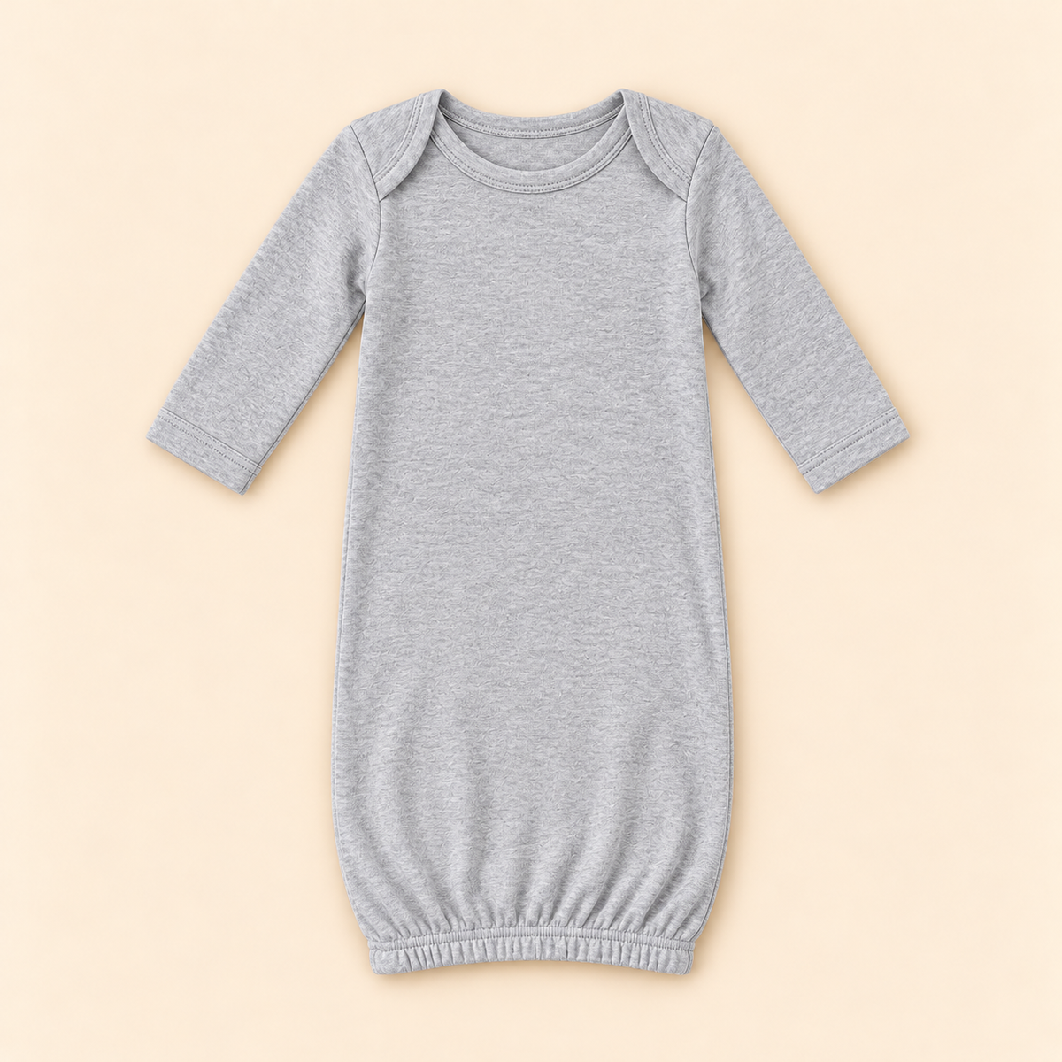 A light gray heather long-sleeve baby sleep sack with a crew neck and elasticized hem, displayed flat against a solid pale beige background.