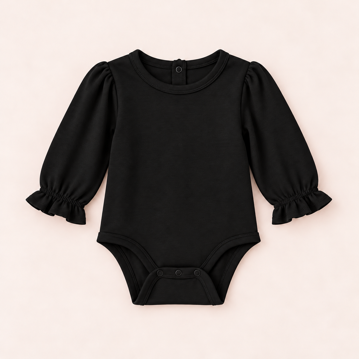 A black long-sleeve baby bodysuit with puffed sleeves and ruffled cuffs, laid flat on a light beige background.
