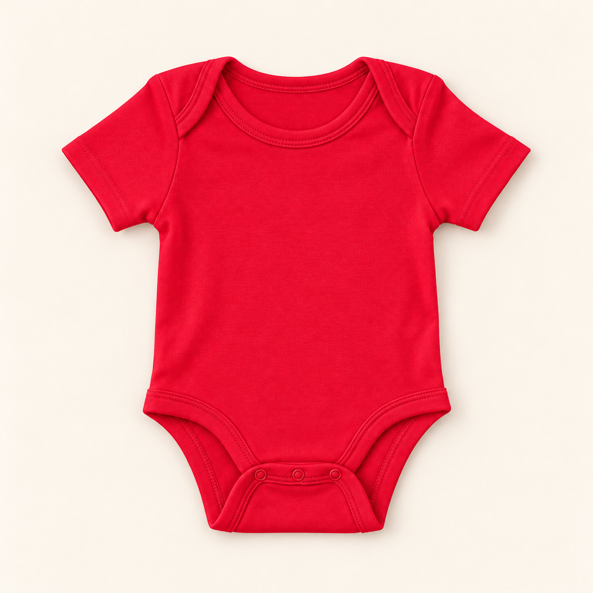 A bright red short-sleeve baby bodysuit with three-button crotch, laid flat on a light cream background.